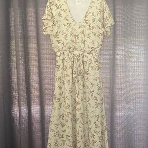 Designed by Sienna Sky. Size medium. Tan with navy and orange flower designs.